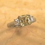 Asscher Cut Fancy Yellow Diamond Ring with Step Cut Trapezoid Accents
