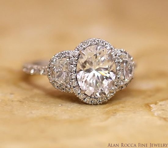 Oval and Half-Moon Three Stone Diamond Ring with Prong Set Halo